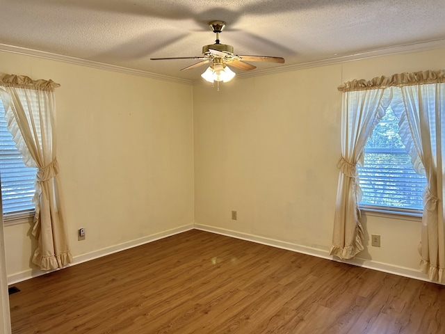 empty room with a textured ceiling and dark hardwood / wood-style floors