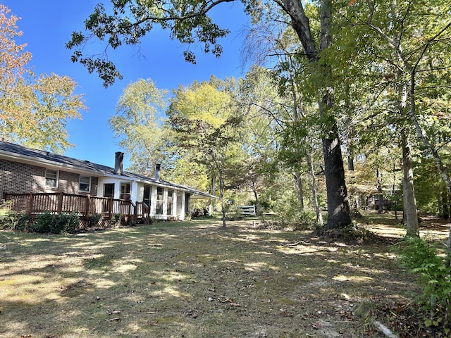 view of yard featuring a deck