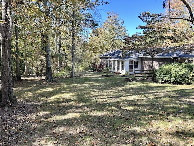 view of yard with a deck