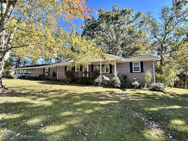 ranch-style house with a front lawn