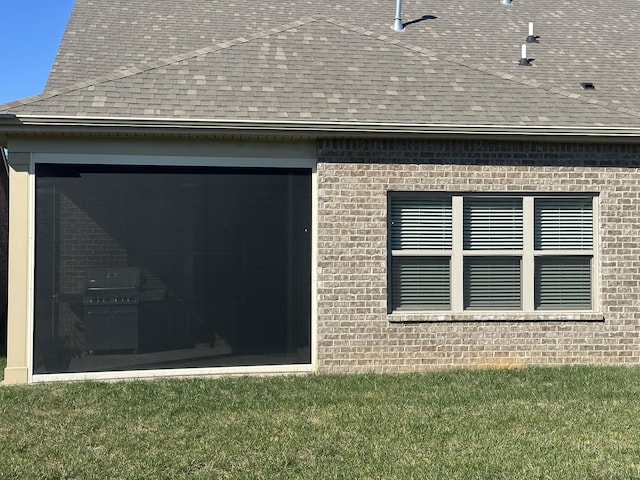 1509 Cedarbrooke Ln, Lebanon, TN 37090 - view of home's exterior featuring brick siding, a shingled roof, and a lawn