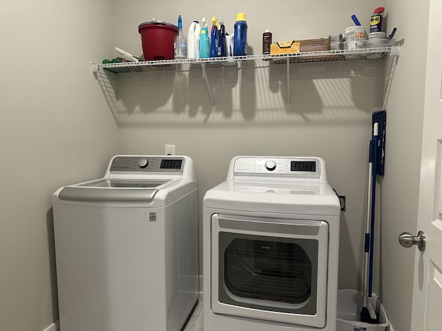 laundry area featuring washing machine and clothes dryer