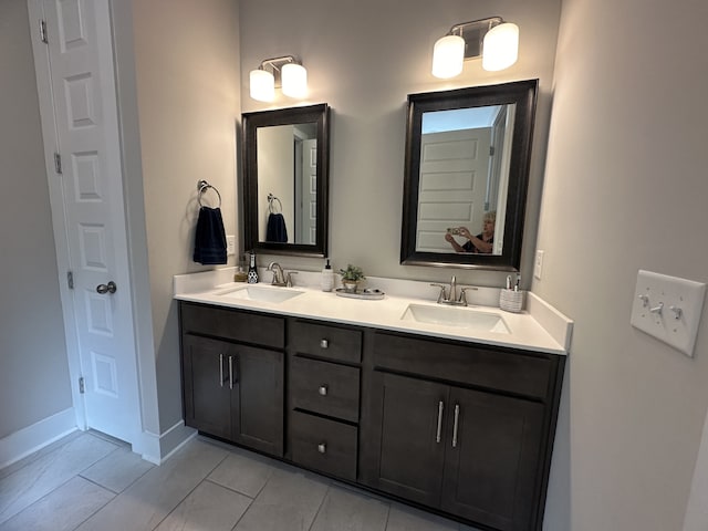 bathroom with tile patterned floors and vanity