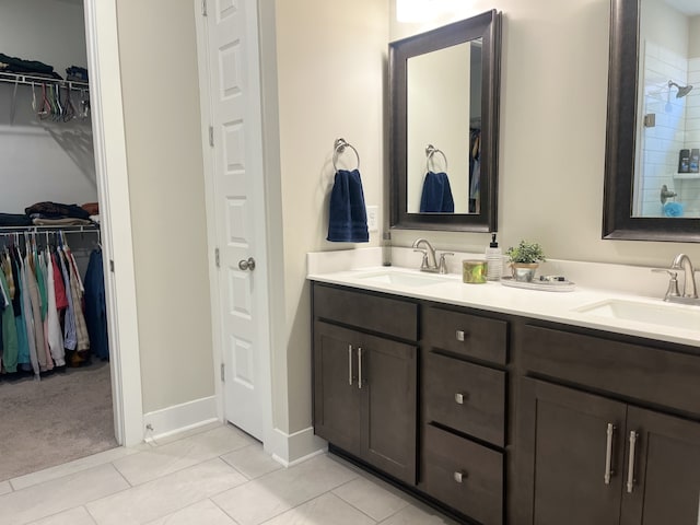 bathroom with tile patterned flooring and vanity