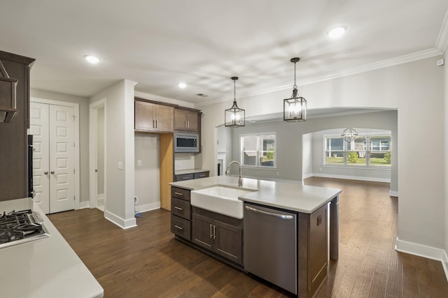 1509 Cedarbrooke Ln, Lebanon, TN 37090 - kitchen featuring appliances with stainless steel finishes, light countertops, recessed lighting, dark wood-type flooring, and crown molding