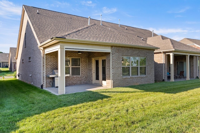 1509 Cedarbrooke Ln, Lebanon, TN 37090 - back of house with a patio, brick siding, and a yard
