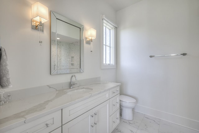 bathroom featuring vanity, toilet, and walk in shower