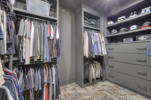 walk in closet featuring light parquet floors