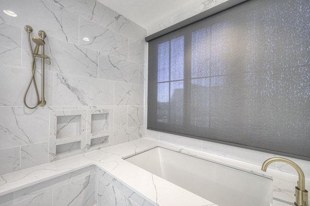 bathroom featuring shower with separate bathtub