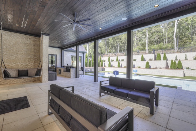 view of patio / terrace featuring ceiling fan, a pool with hot tub, and an outdoor living space