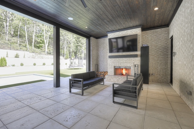 view of patio featuring an outdoor living space with a fireplace