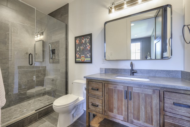 bathroom featuring vanity, toilet, walk in shower, and tile patterned flooring