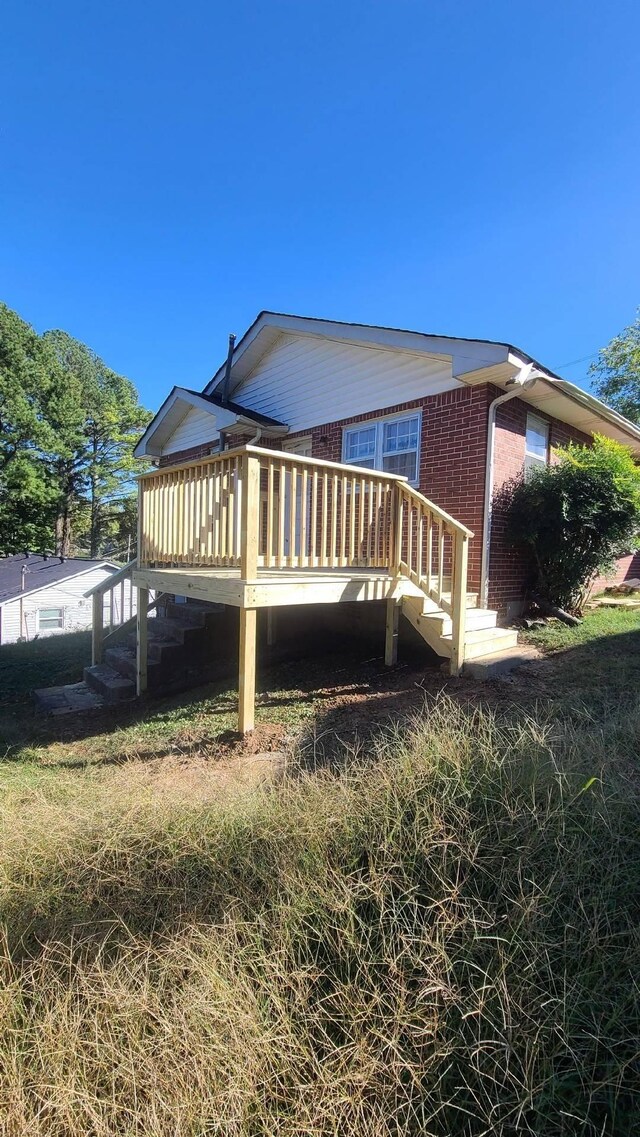 407 College Ave E, Carthage, TN 37030 - view of property exterior with brick siding, stairway, and a deck
