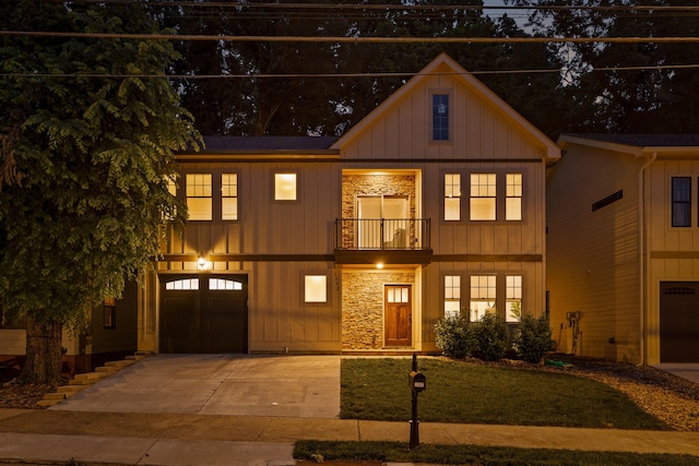 view of front facade with a front yard, a garage, and a balcony