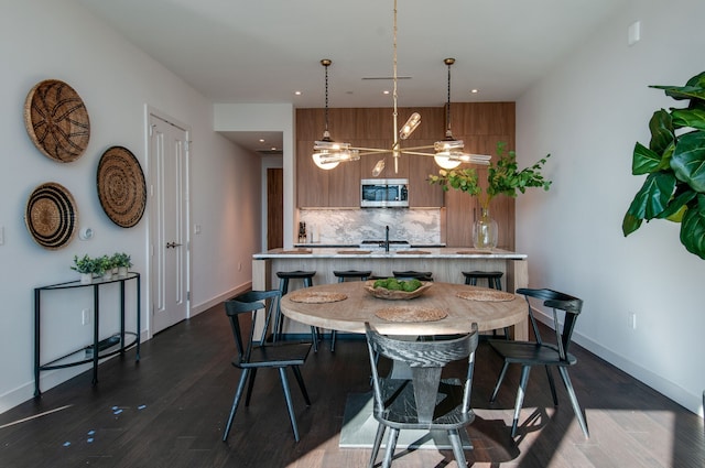 dining space featuring a chandelier and dark hardwood / wood-style flooring