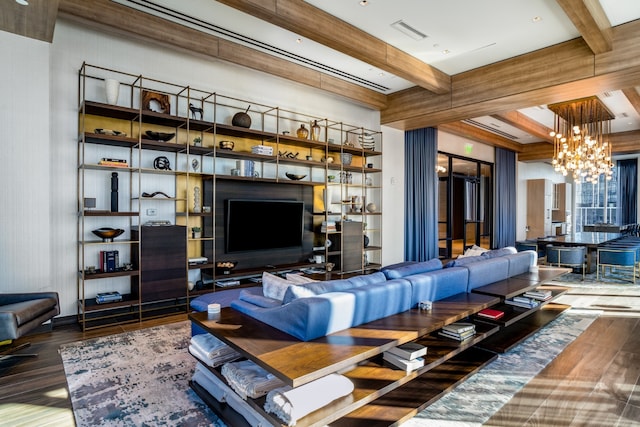 living room featuring a notable chandelier, beamed ceiling, and wood-type flooring