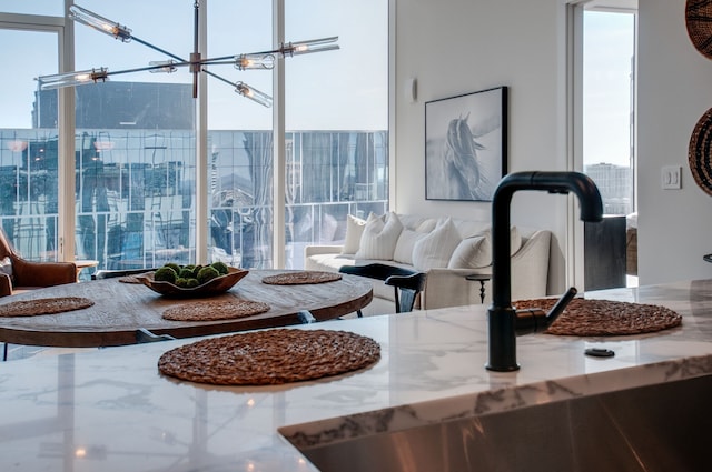 interior space featuring sink and an inviting chandelier