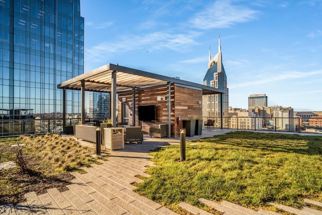 view of home's community featuring a pergola, a patio area, a lawn, and outdoor lounge area