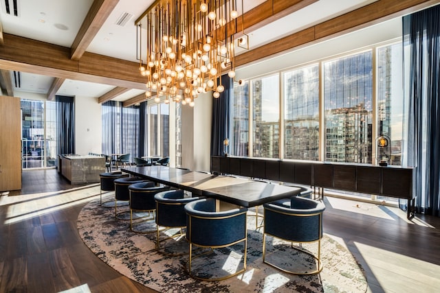 dining room with beamed ceiling and hardwood / wood-style floors