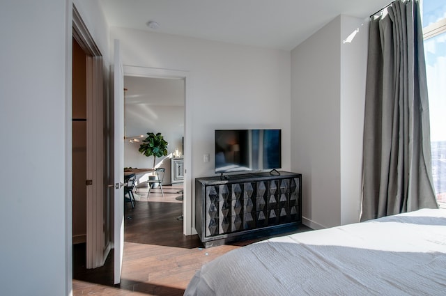 bedroom with wood-type flooring