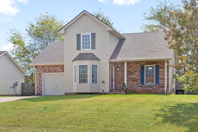 view of front property with a front yard and a garage