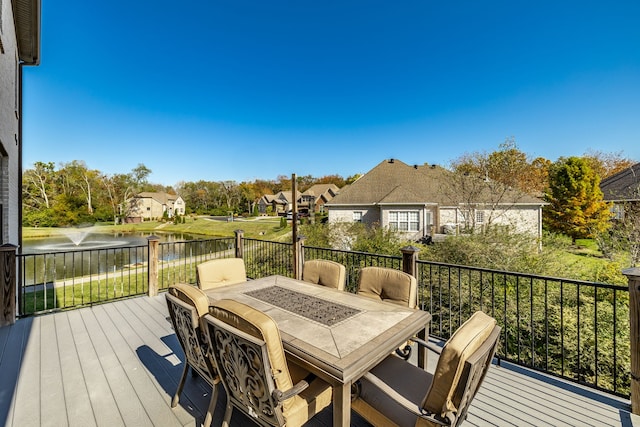 wooden deck featuring a water view