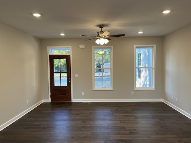 foyer with ceiling fan and dark hardwood / wood-style floors