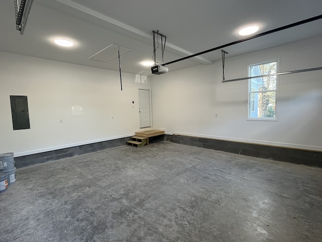 garage featuring a garage door opener and electric panel