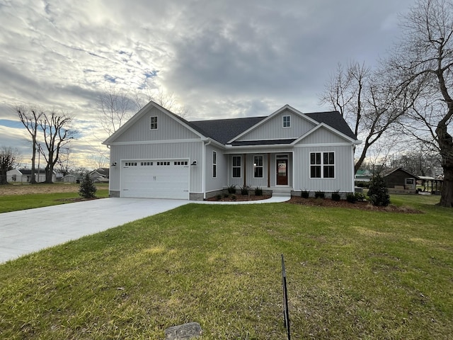 view of front facade with a garage and a front yard