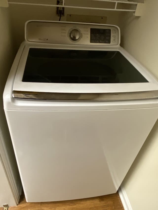 washroom featuring washer / clothes dryer and light wood-type flooring