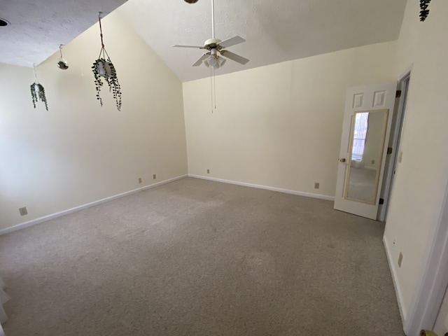 unfurnished room with ceiling fan, light colored carpet, a textured ceiling, and vaulted ceiling