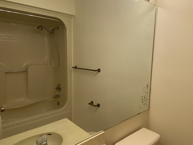 bathroom with shower / tub combination and toilet