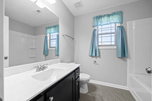 full bathroom with vanity, toilet, a textured ceiling, and shower / bathtub combination