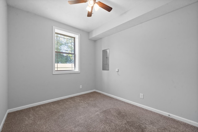 carpeted spare room with electric panel and ceiling fan