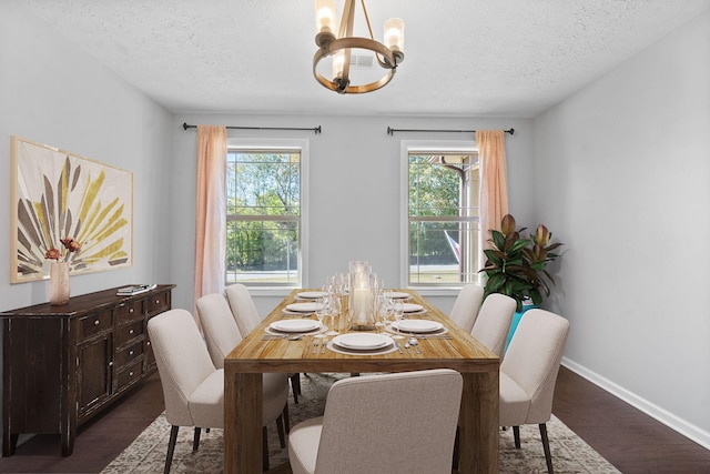 dining space with a chandelier, dark wood-style flooring, and a healthy amount of sunlight