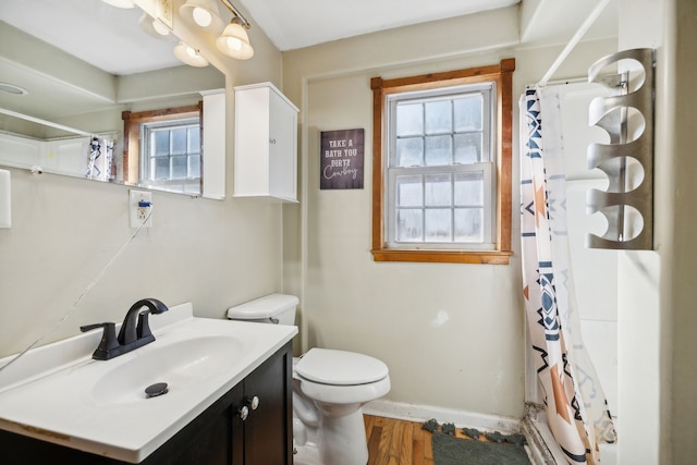 bathroom featuring vanity, a shower with curtain, wood-type flooring, and toilet