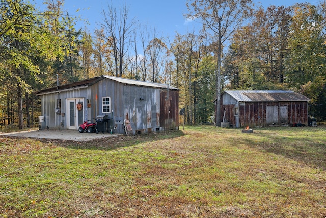 view of outbuilding with a lawn