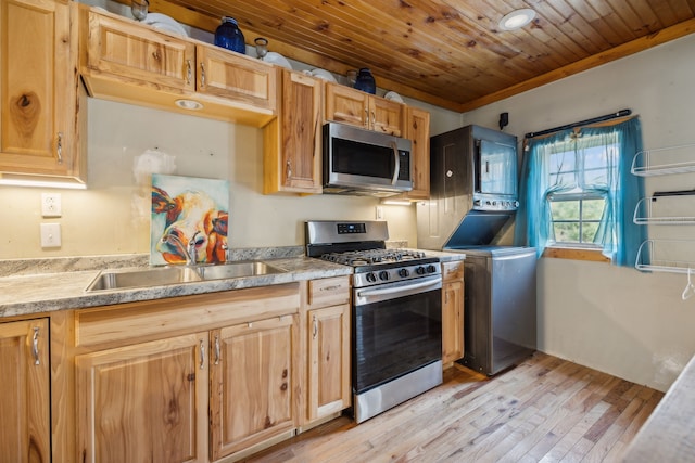 kitchen featuring wood ceiling, appliances with stainless steel finishes, light wood-type flooring, crown molding, and sink