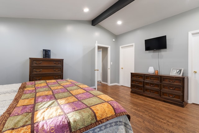 bedroom featuring dark wood-type flooring and vaulted ceiling with beams