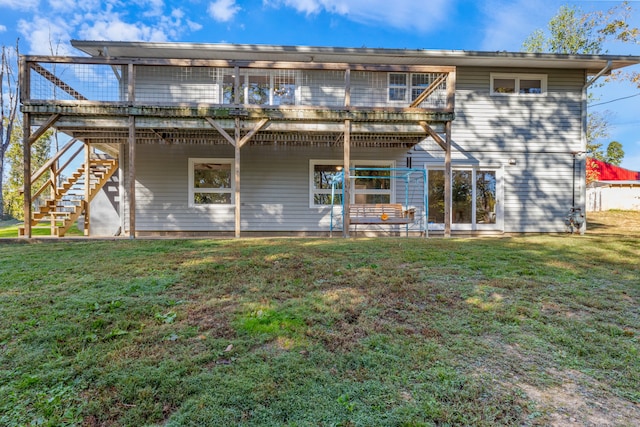 back of house featuring a patio and a yard