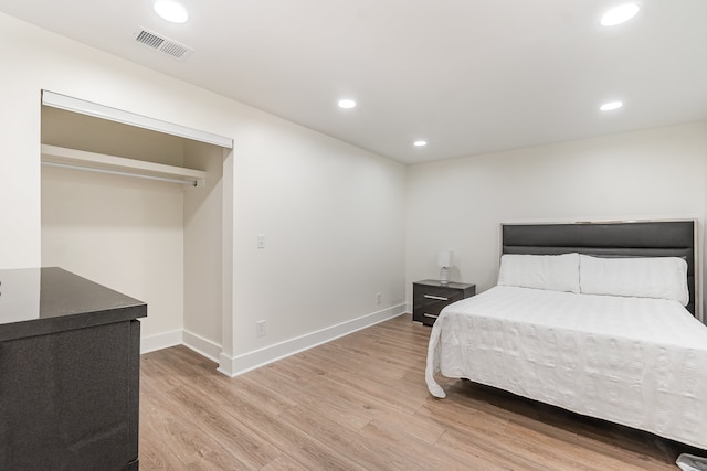 bedroom with light hardwood / wood-style floors