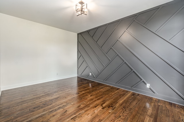 spare room with dark wood-type flooring