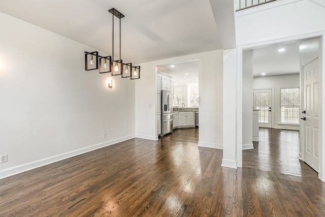 unfurnished dining area with dark hardwood / wood-style floors and sink