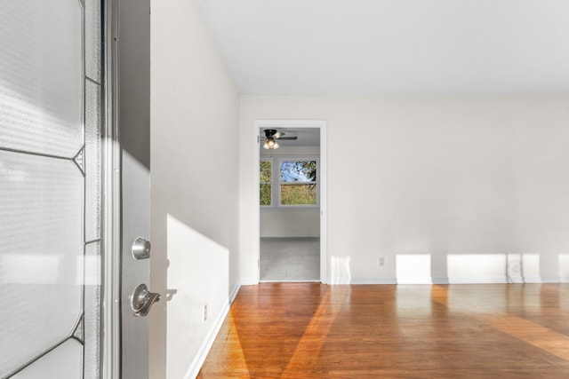 interior space with hardwood / wood-style floors and ceiling fan