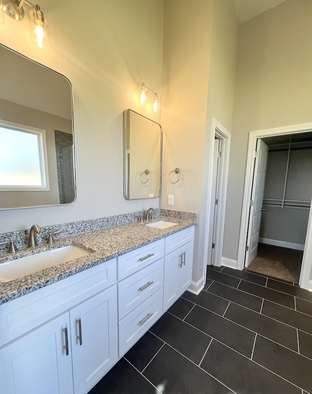 bathroom with vanity and tile patterned floors