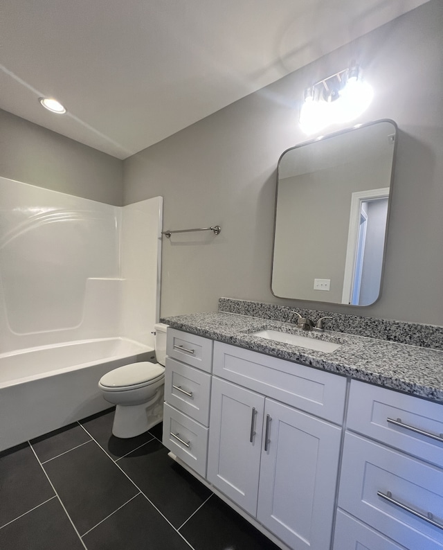 full bathroom with shower / tub combination, tile patterned floors, vanity, and toilet