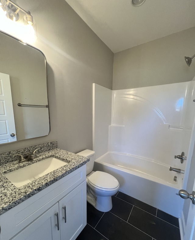 full bathroom with shower / washtub combination, toilet, tile patterned flooring, and vanity