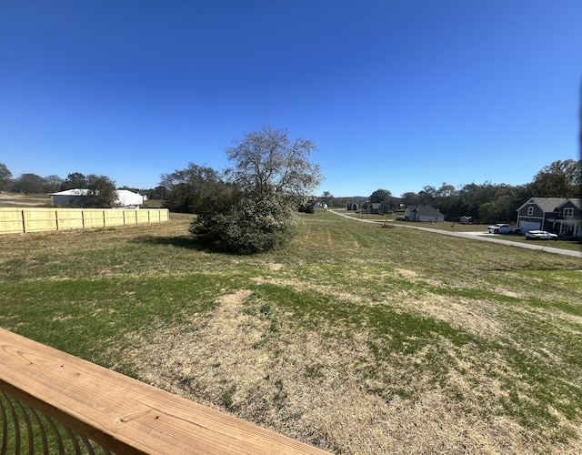 view of yard with a rural view