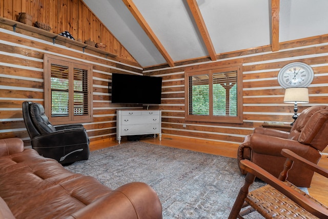 living room featuring beamed ceiling, hardwood / wood-style floors, a healthy amount of sunlight, and high vaulted ceiling