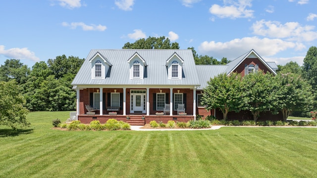 cape cod house with covered porch and a front lawn